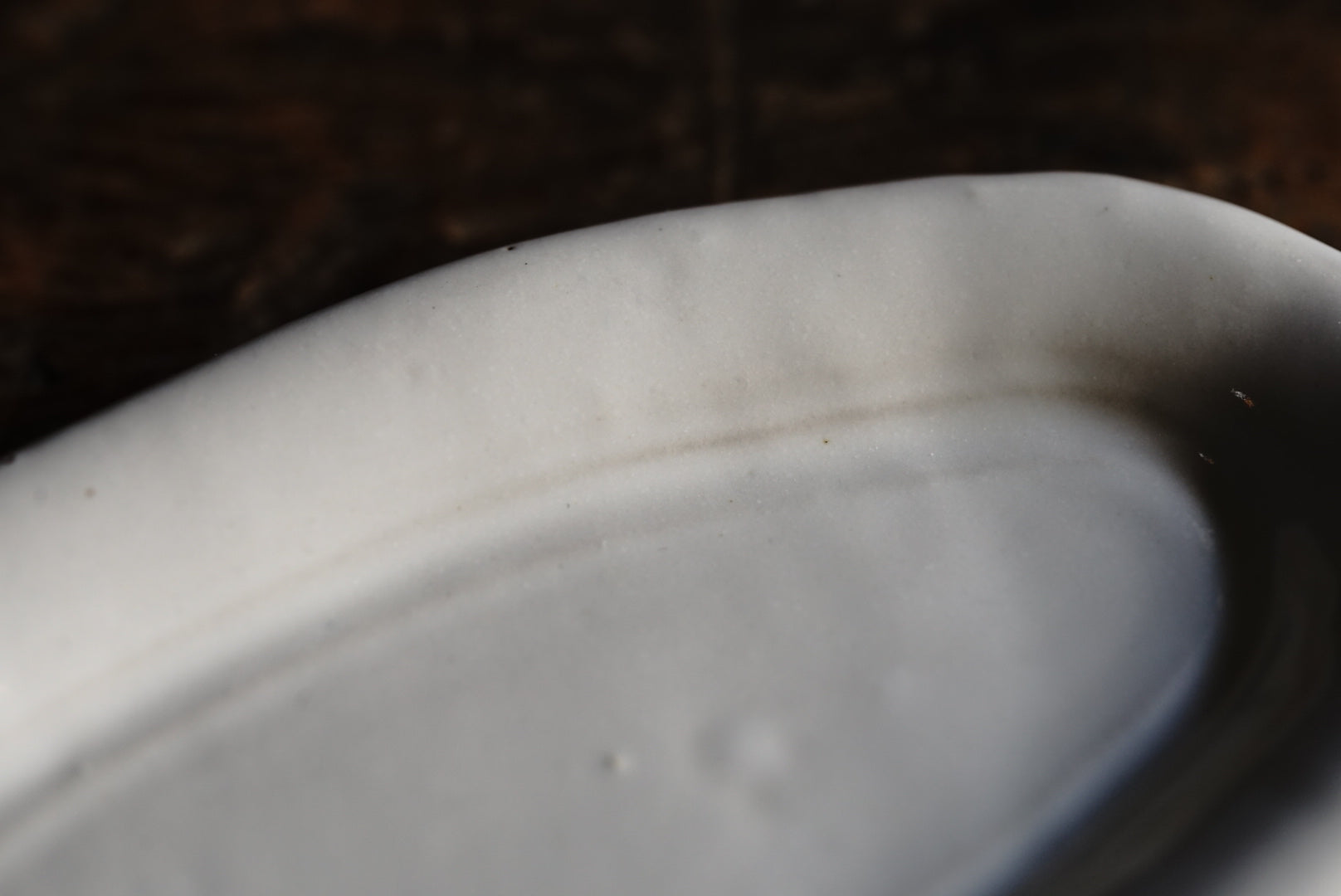 White glaze round edge ellipse small plate / Yuichi Nakata